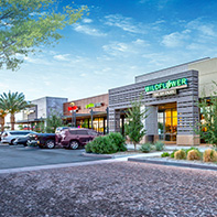 restaurant entrances with parking spots in foreground