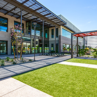 exterior of office building with grassy common area