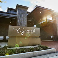 entrance sign to the grand event center