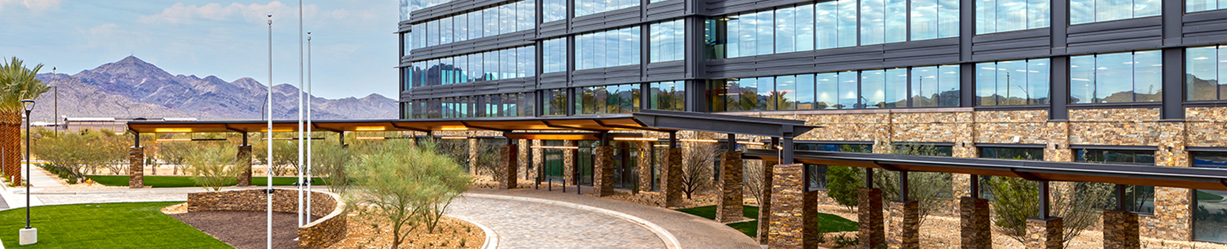 office building with mountains in background